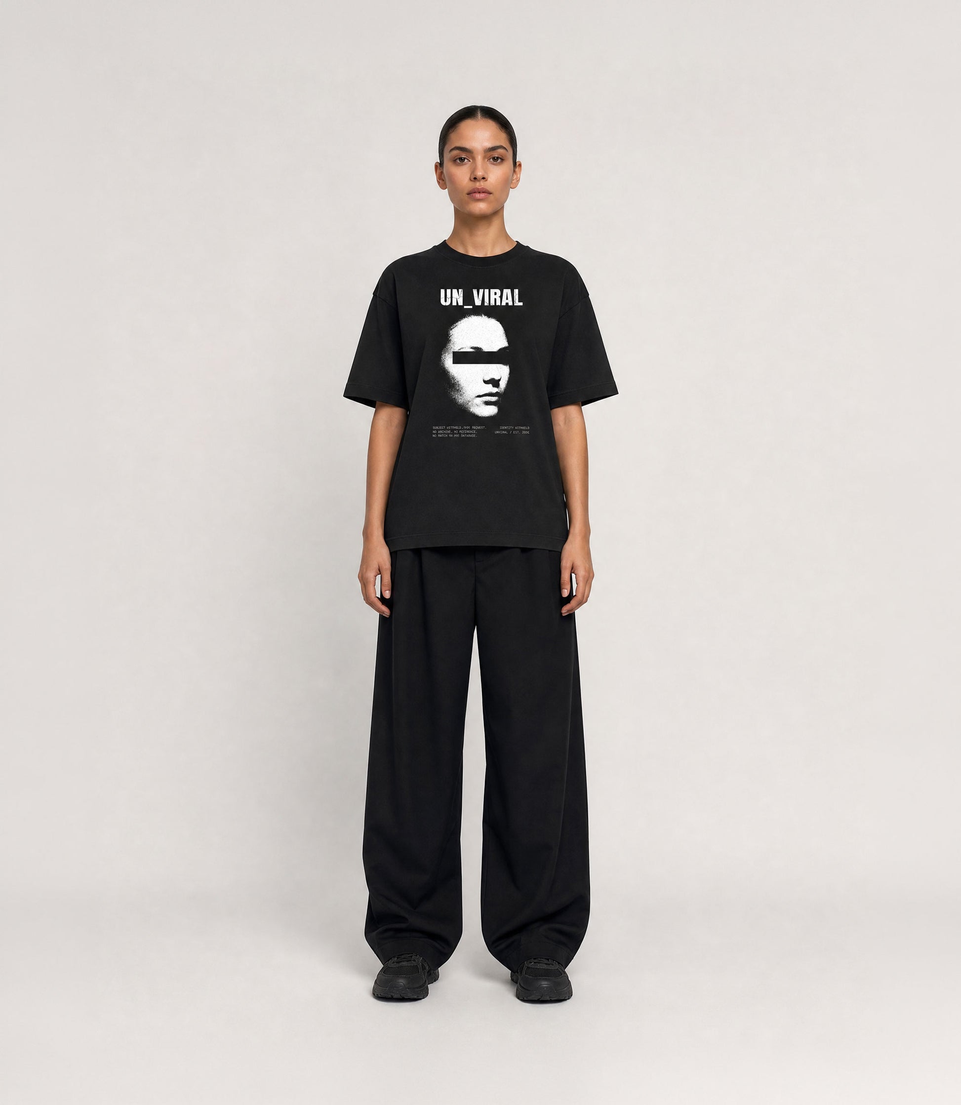Identity Withheld black oversized tee — print detail