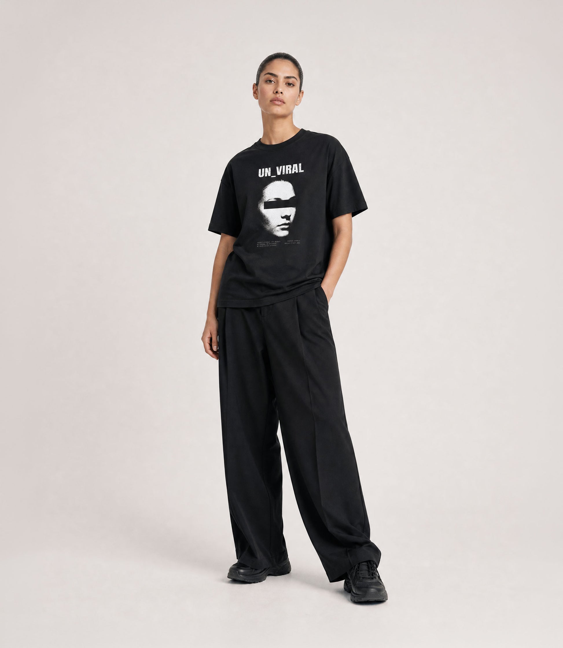 Identity Withheld black tee worn, oversized fit