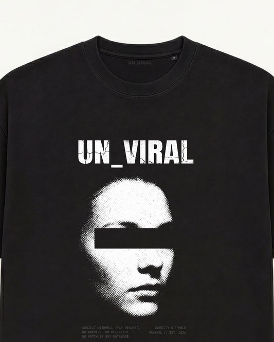 Identity Withheld tee in black with redacted portrait and censorship bar over the eyes  
