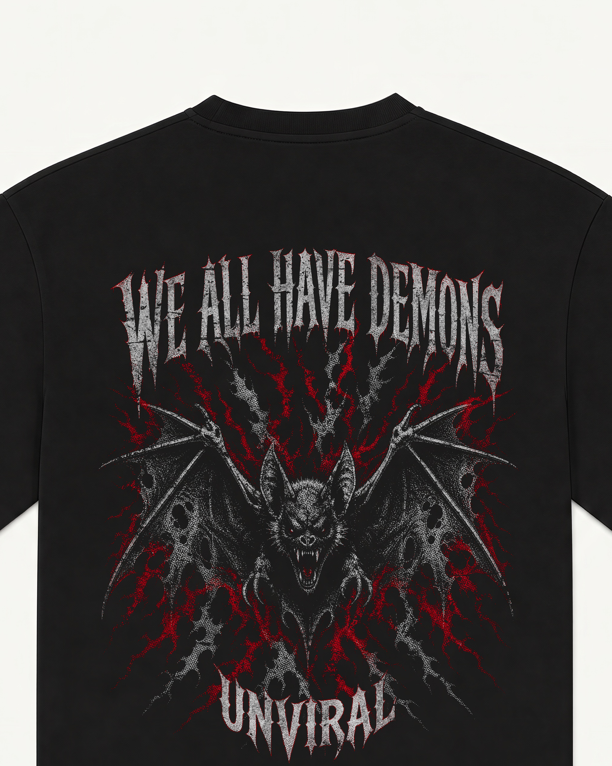 Close-up of the We All Have Demons bat illustration back print on a black oversized UNVIRAL tee