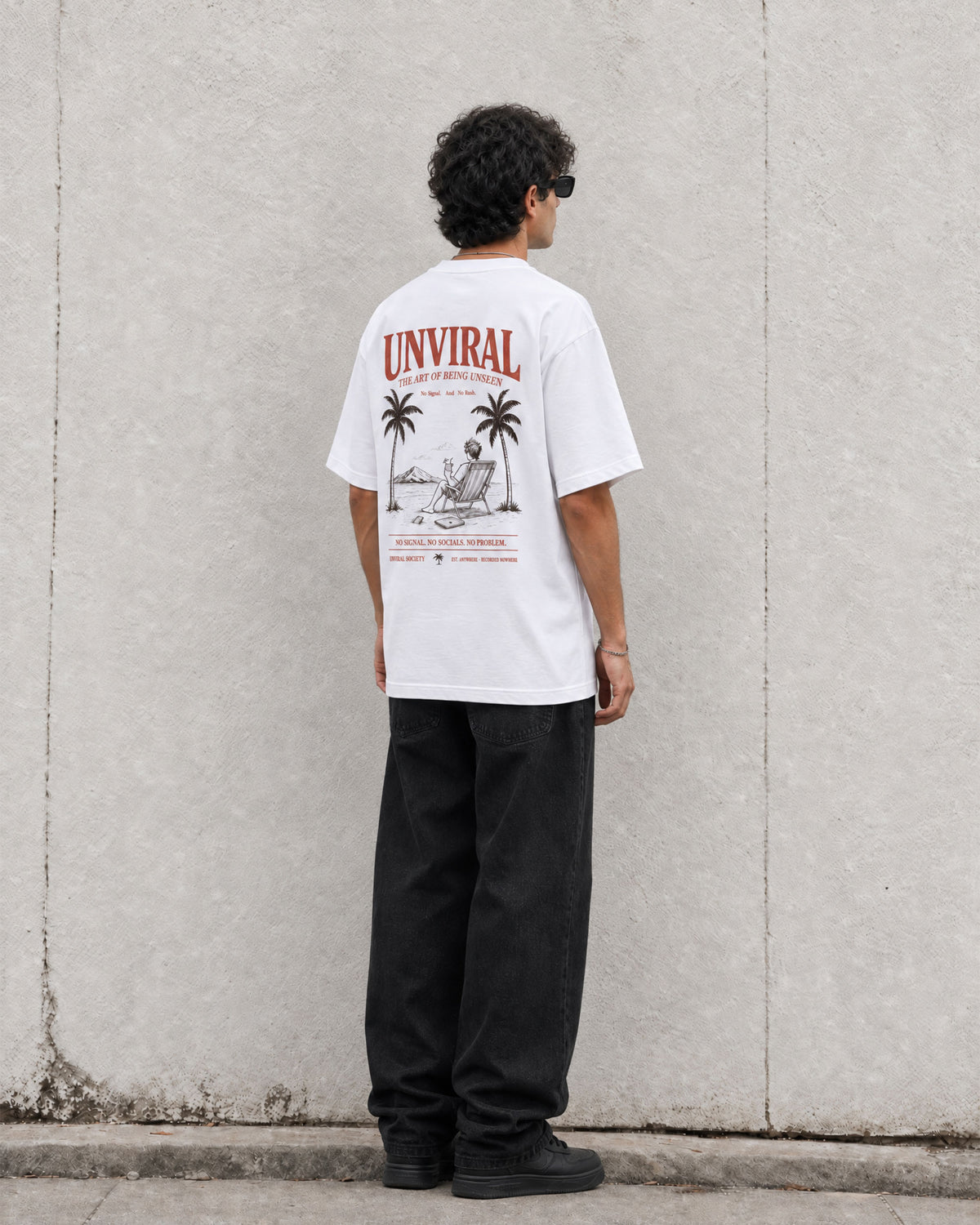 The Art of Being Unseen white oversized tee worn on model, detail
