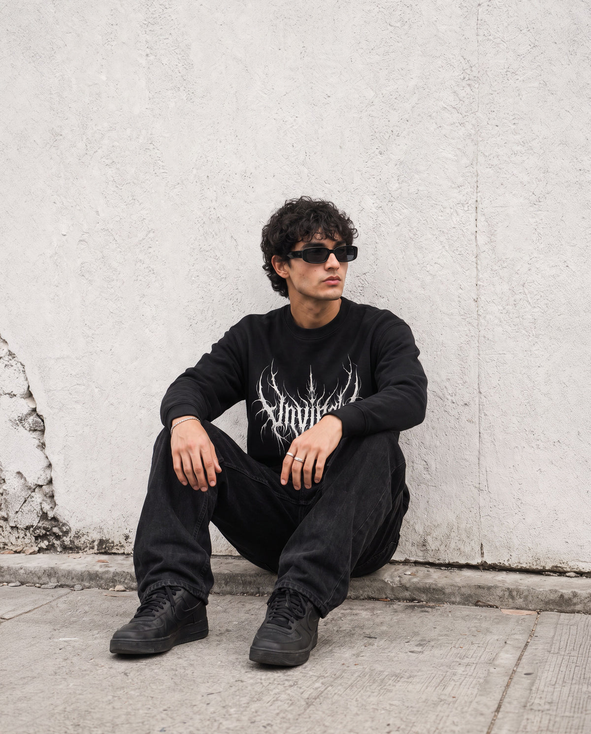 Rootbound UNVIRAL black sweatshirt worn on model, front