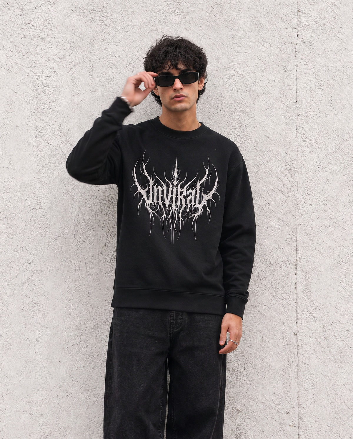 Rootbound UNVIRAL black sweatshirt worn on model