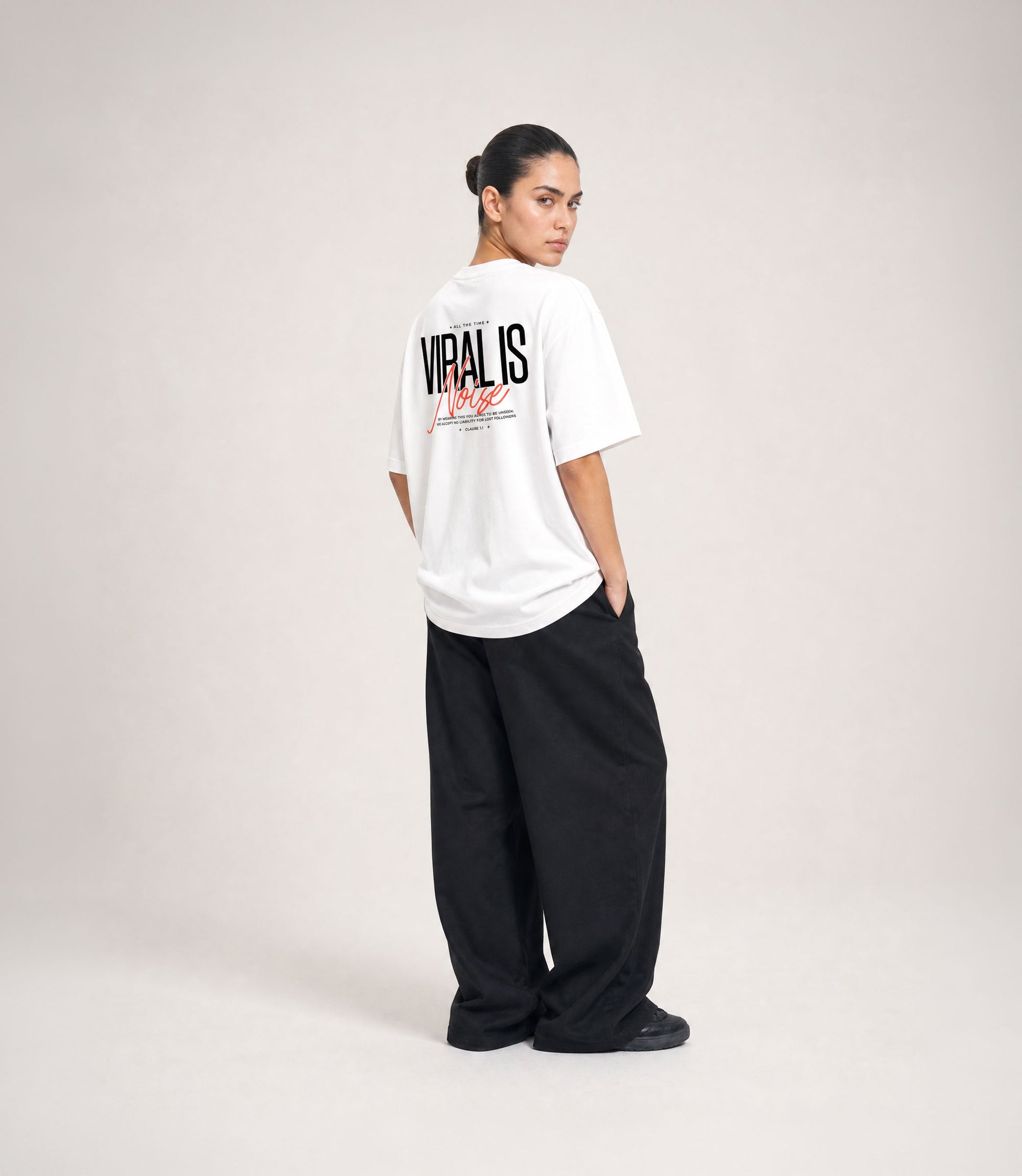 Viral Is Noise white oversized tee — typographic detail