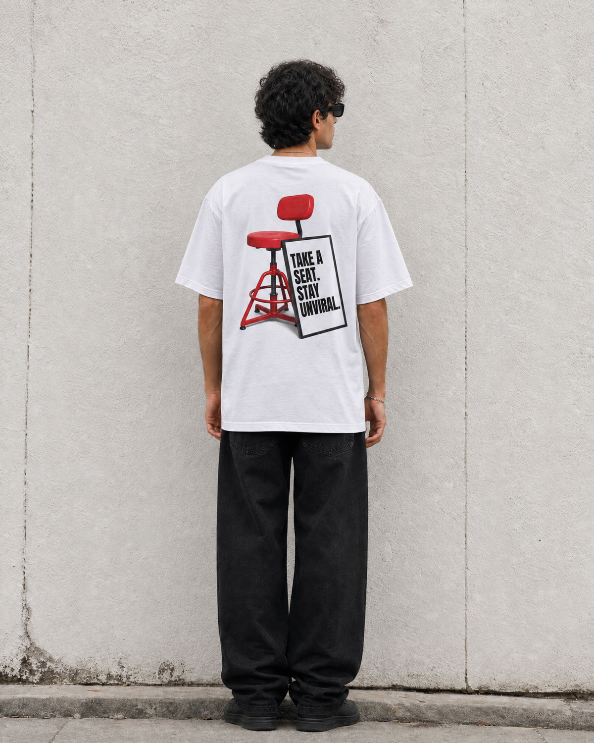 Take a Seat white oversized tee worn on model