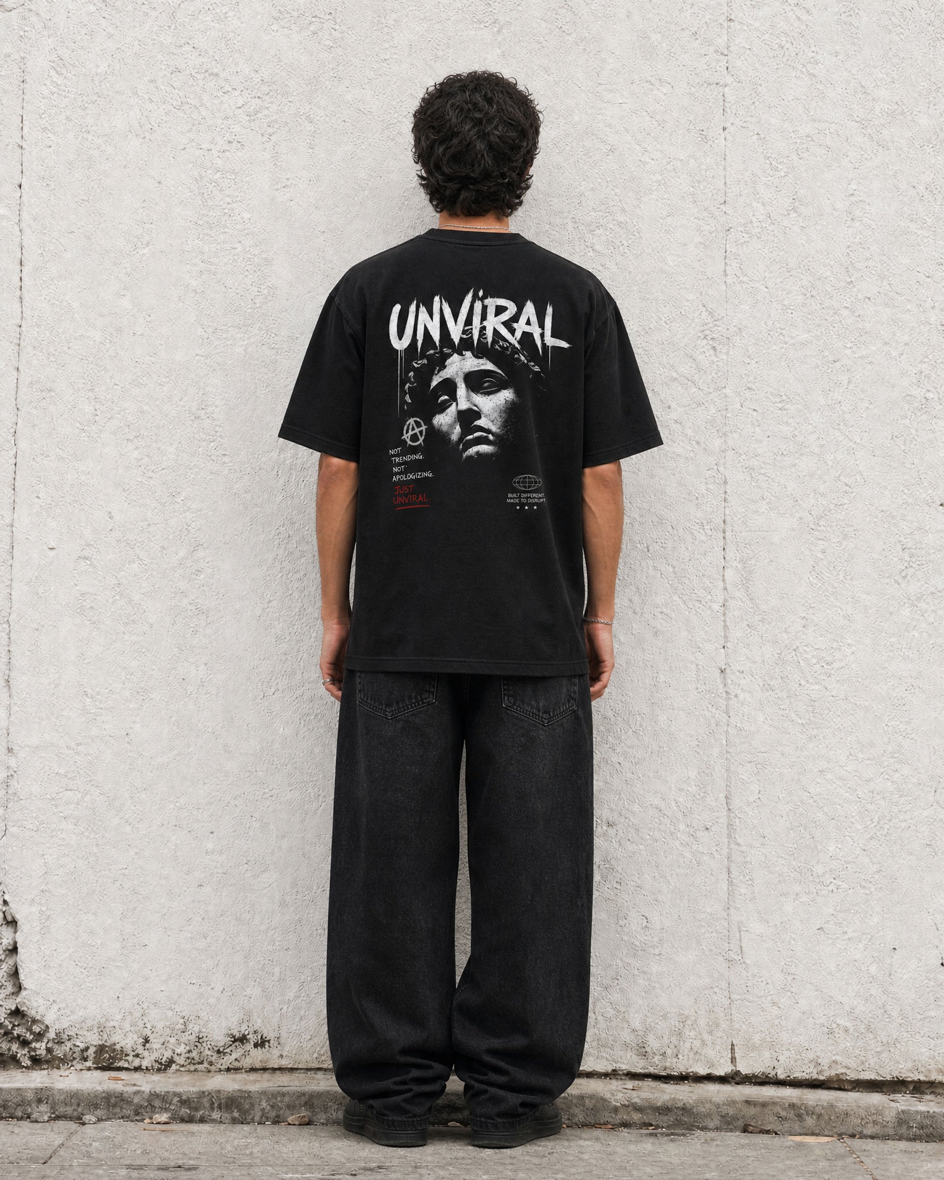 Made to Disrupt black oversized t-shirt worn on model, front view