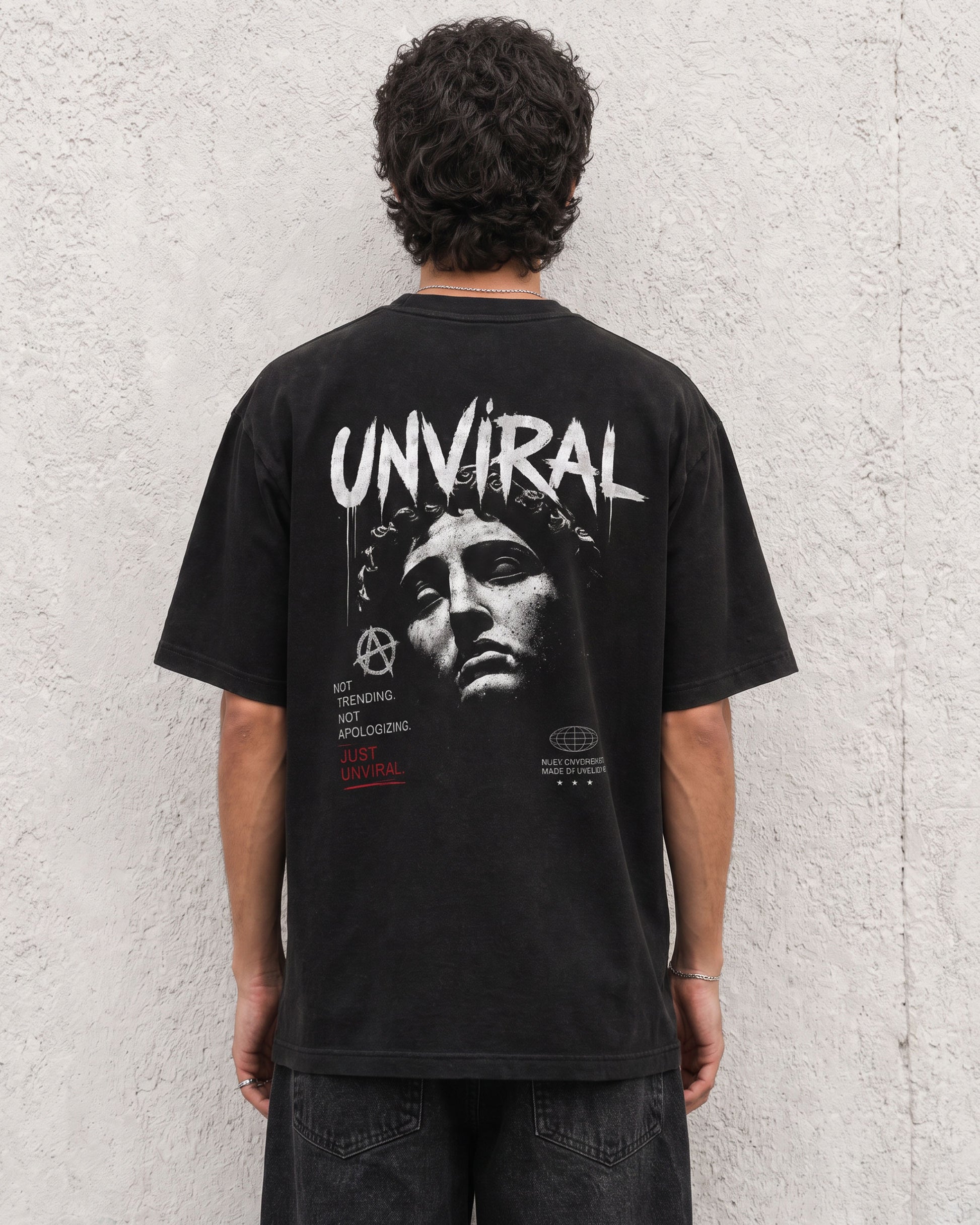 Made to Disrupt black oversized t-shirt worn on model, side view