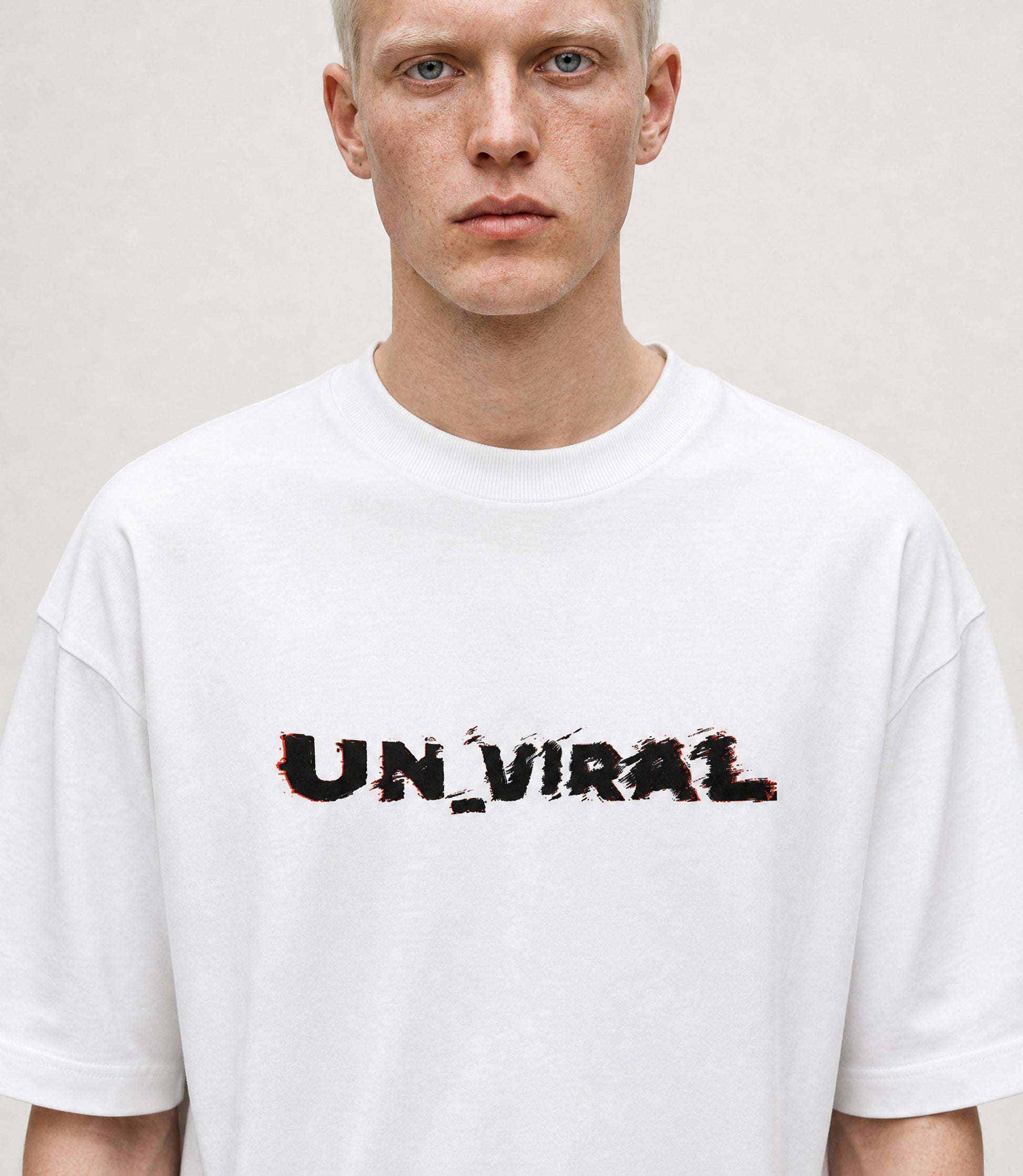 Glitch UN_VIRAL white tee worn, oversized fit