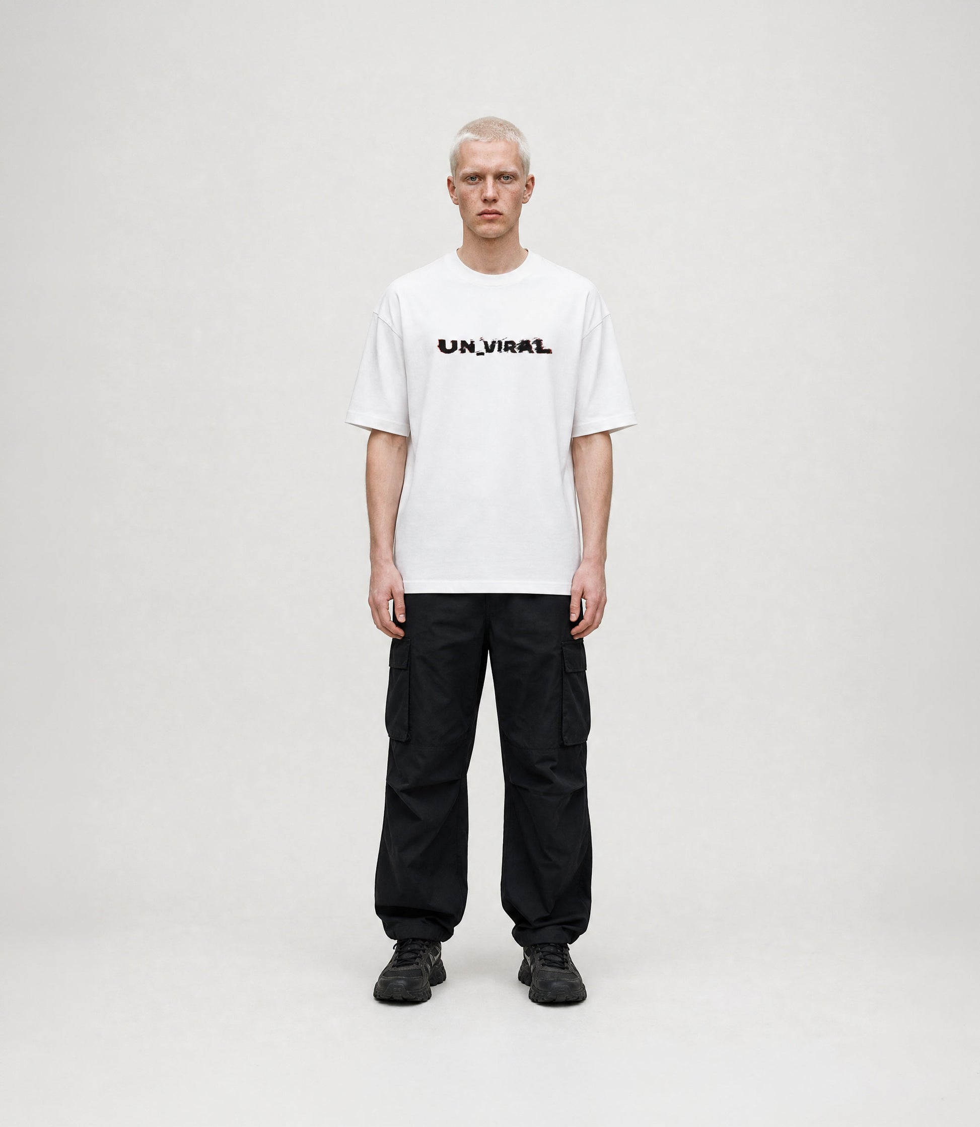 Glitch UN_VIRAL white oversized tee — chromatic print detail